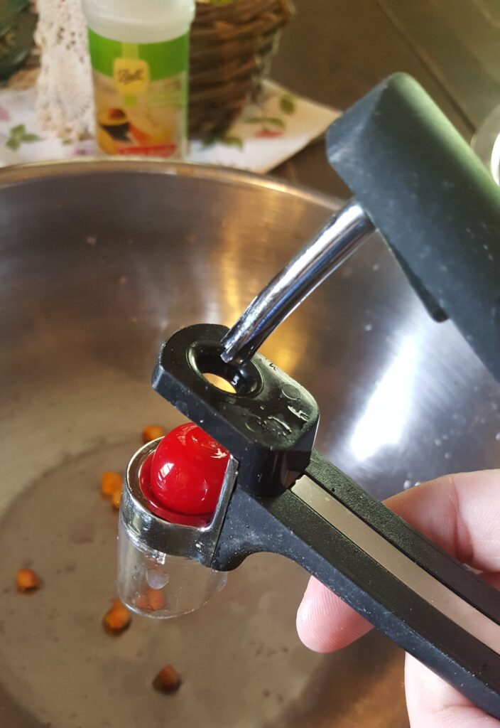 pitting cherries with a convenient little cherry pitter