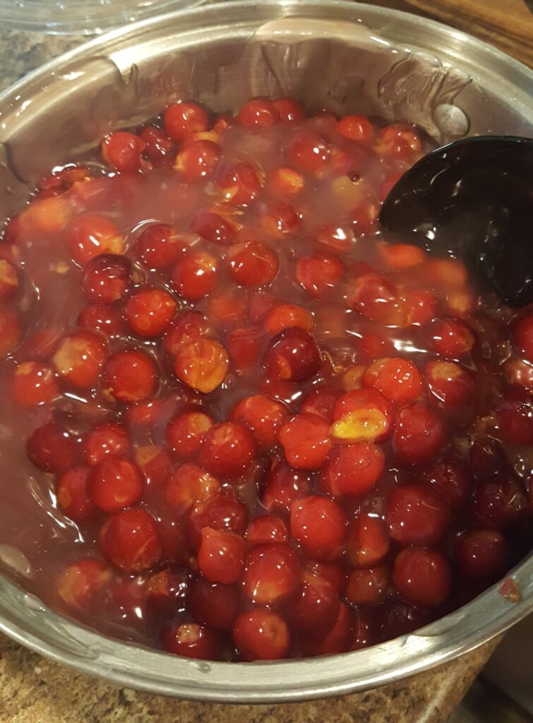 Cherries added to the pot of the thick mixture