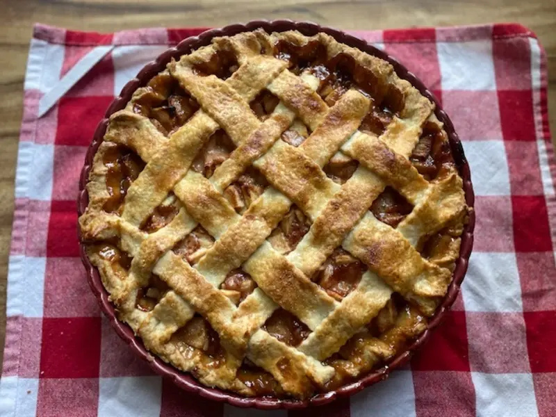 apple pie with golden crust and bubbly apple filling fresh from the oven