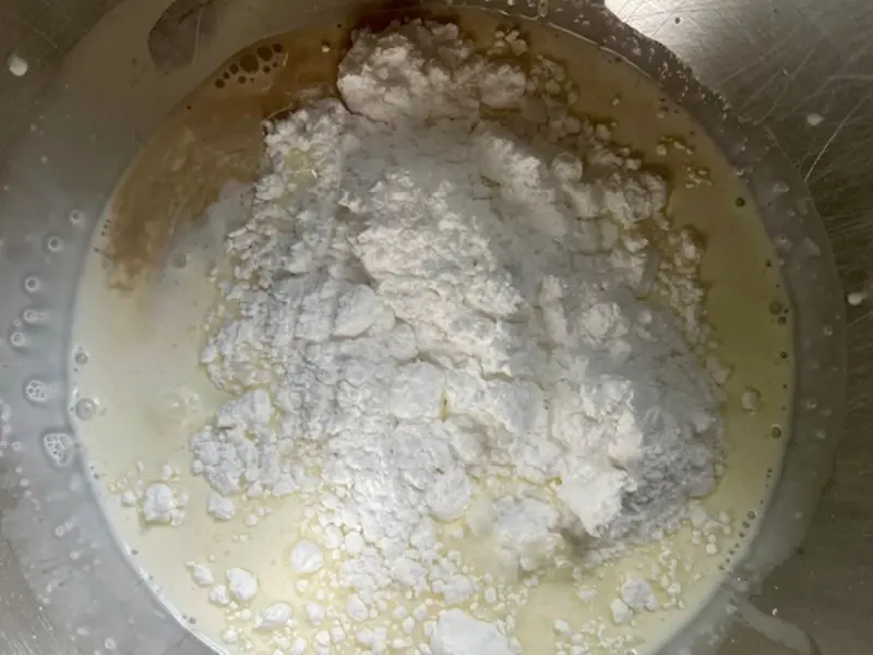 Heavy cream, sugar and vanilla in a mixing bowl to make homemade whipped cream