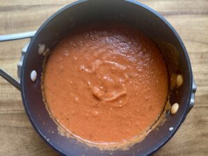 Easy Creamy Roasted Tomato Soup made with fresh garden tomatoes, onion, and garlic. A cozy, comforting soup perfect for summer harvest or chilly fall nights. Pin this recipe for delicious homemade soup to warm up with!