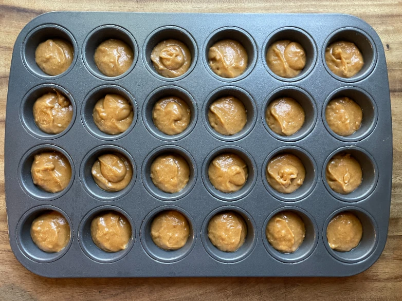 mini pumpkin muffins in mini muffin tin