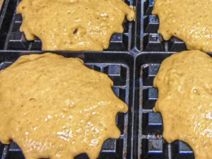 Pumpkin Chai Waffles - batter in a waffle iron