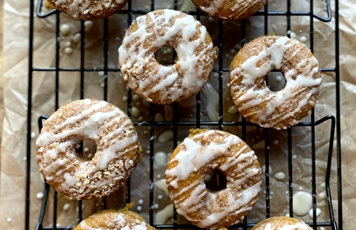 baked pumpkin donuts with streusel and maple glaze drizzle