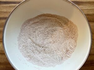 dry ingredients for baked pumpkin donuts with streusel and maple glaze drizzle
