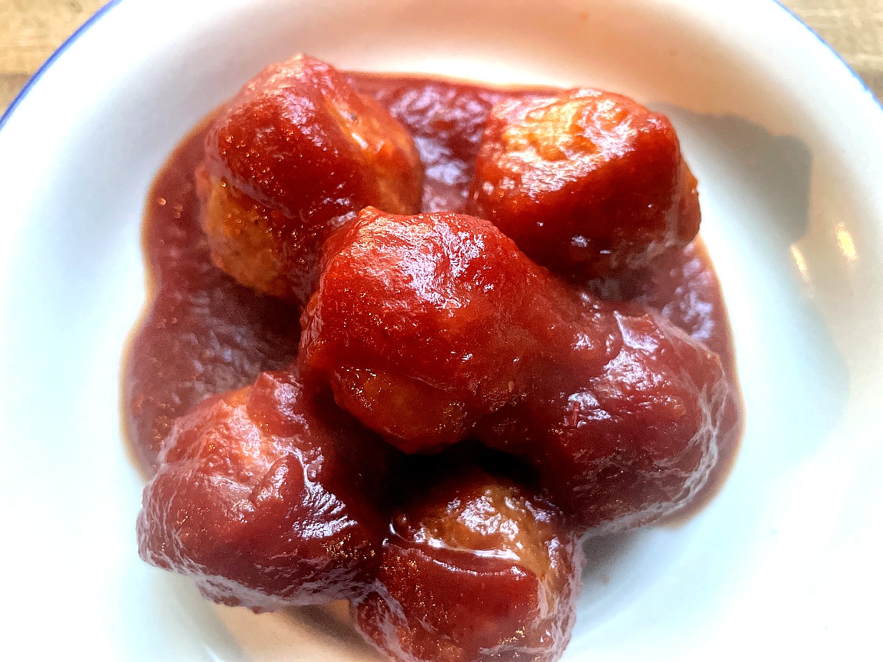 Saucy cranberry chili meatballs served on a plate