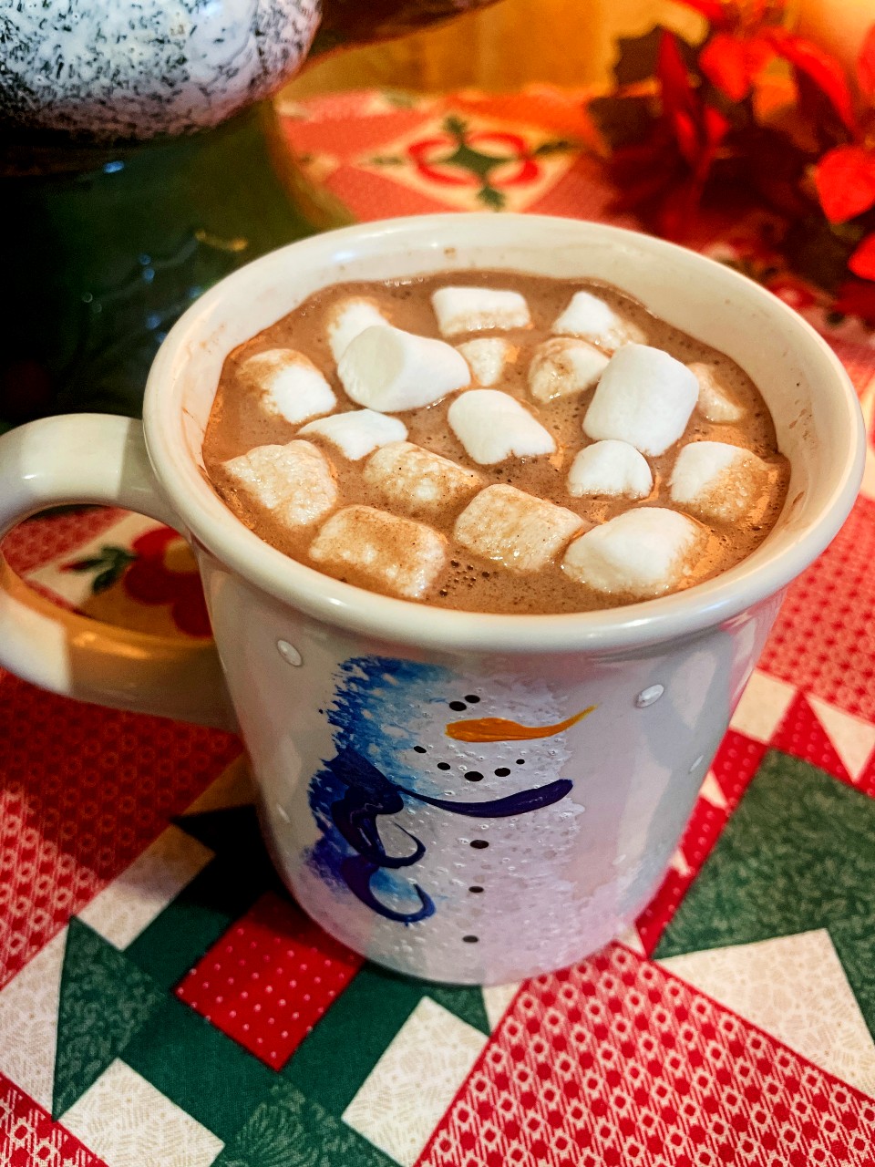 Warm cocoa topped with marshmallows.