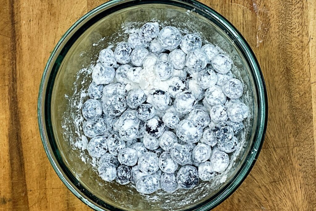 blueberries tossed in flour mixture for blueberry muffins