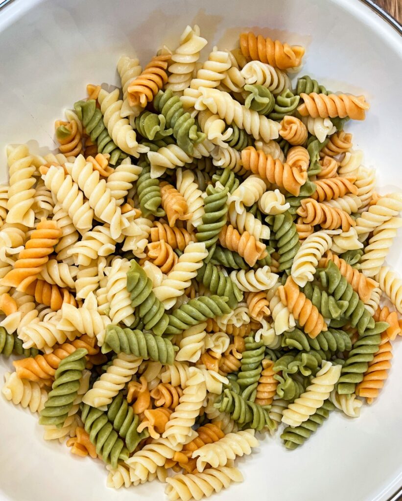 bowl of cooled pasta for creamy pasta salad 