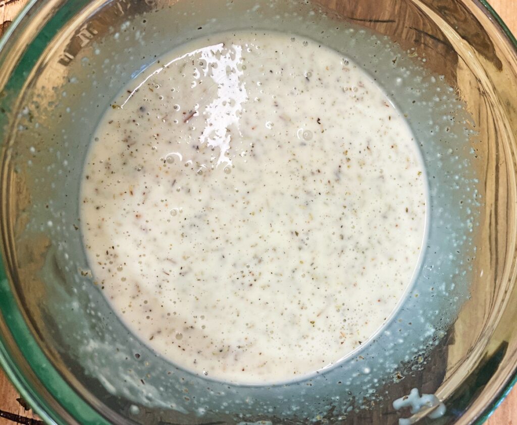 creamy dressing with herbs, oil, vinegar, and mayo for pasta salad