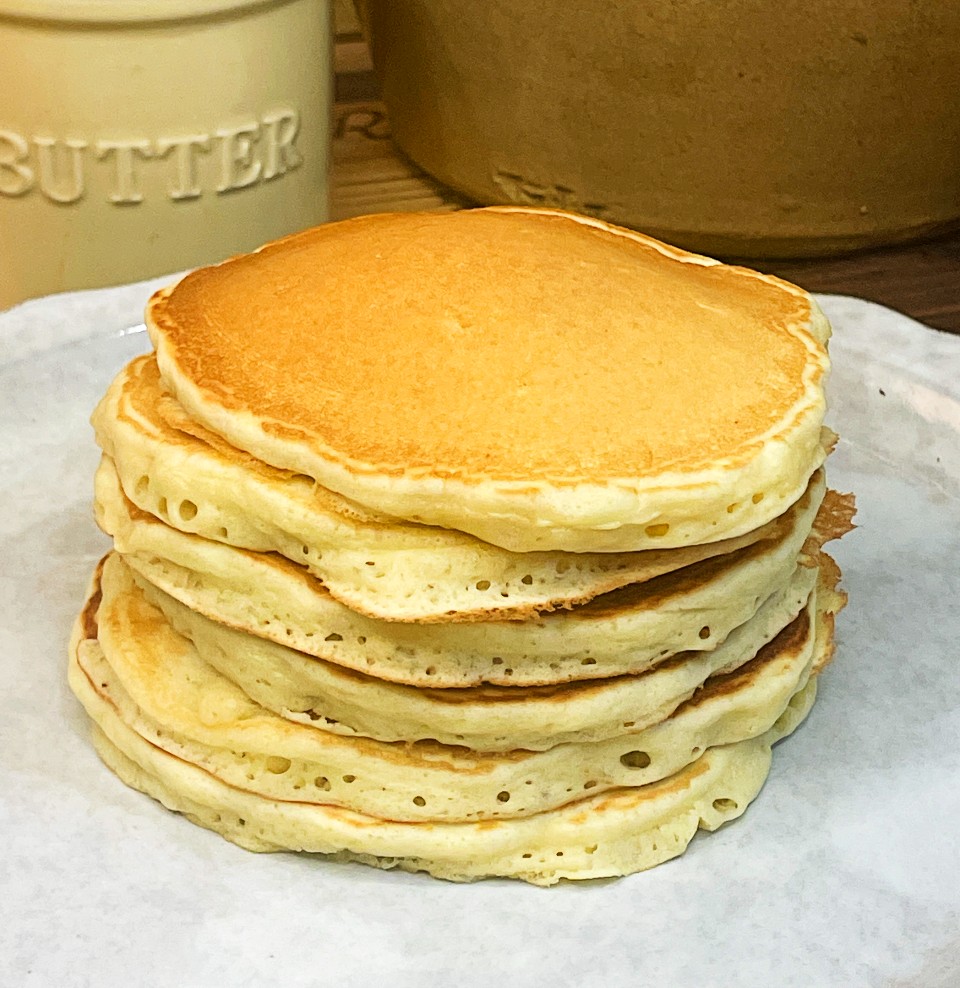 a large stack of fluffy easy homemade pancakes on a plate