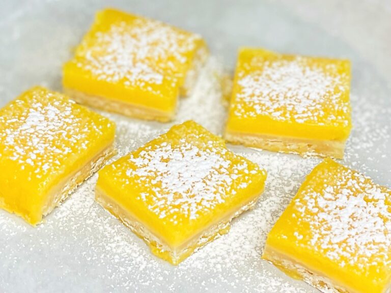 Old-fashioned lemon bars dusted with powdered sugar