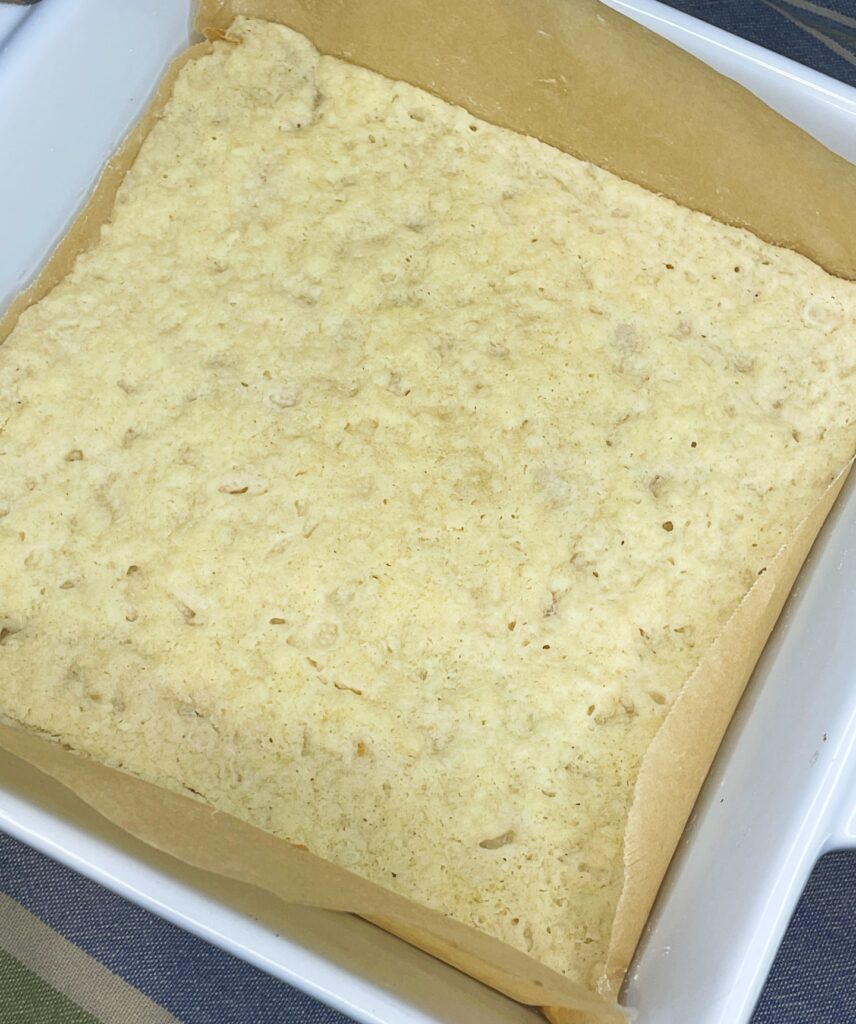 shortbread mixture baked until golden brown and ready for lemon bar filling