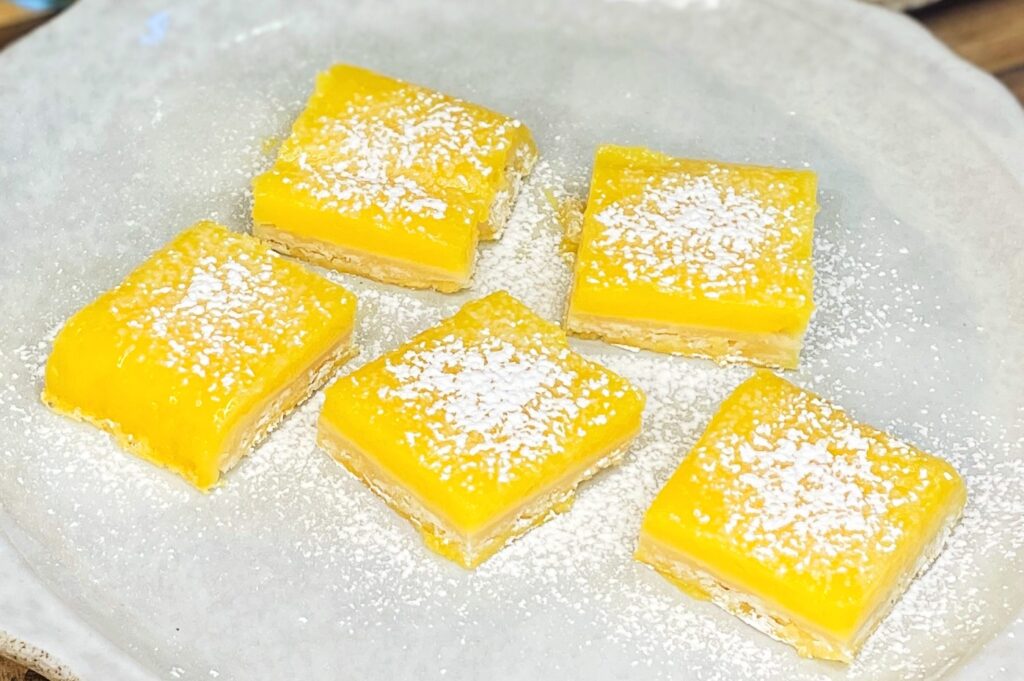 Old-fashioned lemon bars dusted with powdered sugar