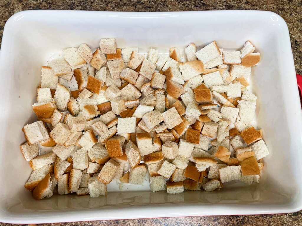 Cubed bread in a baking dish