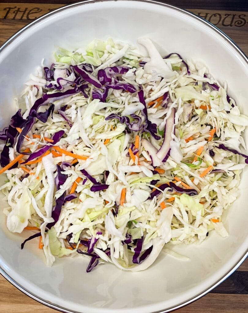 Shredded cabbage and carrot in a big bowl
