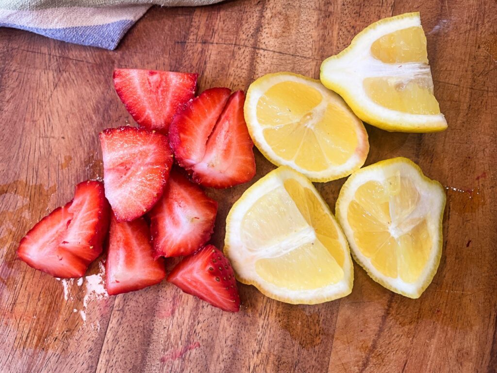 quartered lemon and strawberries