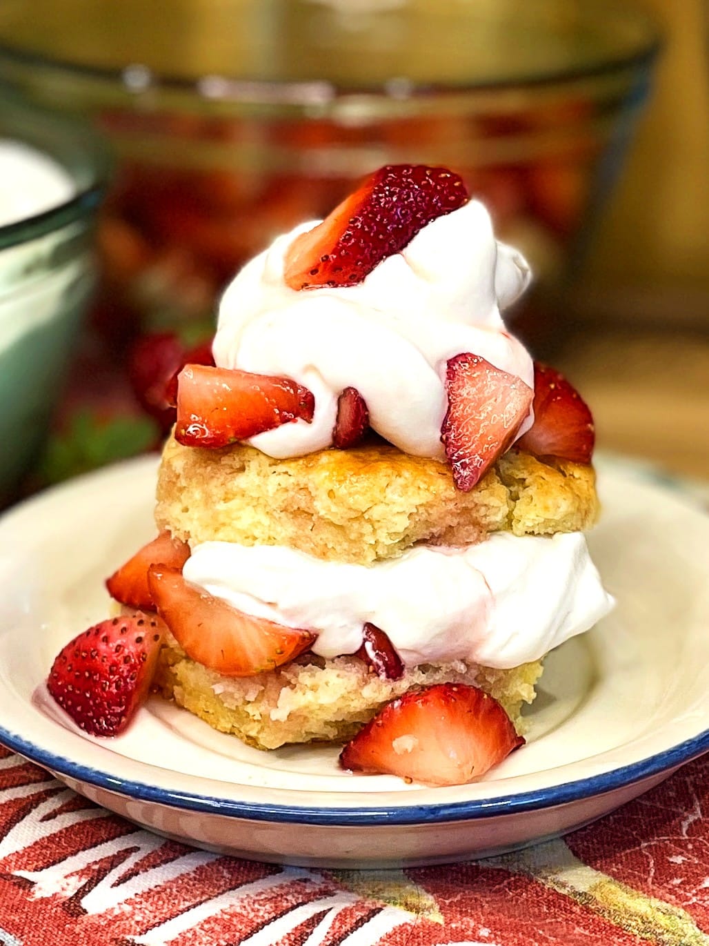 Layers of biscuit, strawberries, and cream for strawberry shortcake