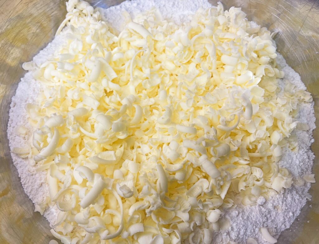 shredded cold butter added and combined with flour mixture for biscuits