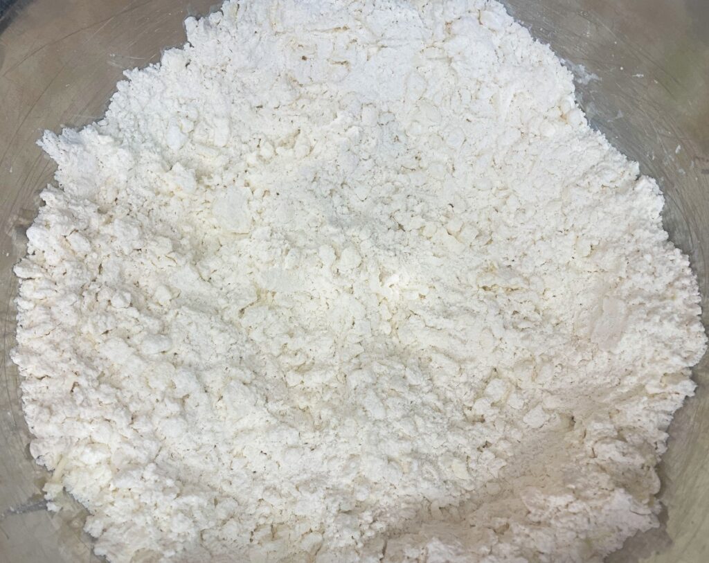 shredded cold butter added and combined with flour mixture for biscuits