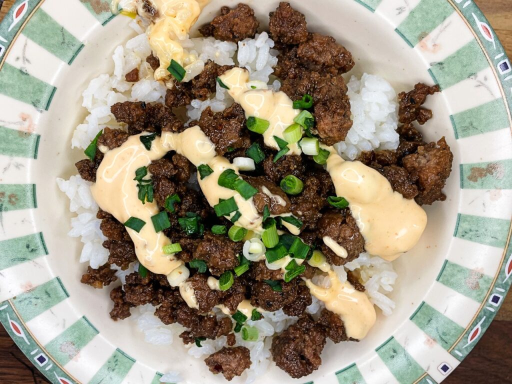 Korean ground beef bowls taste topped with green onion