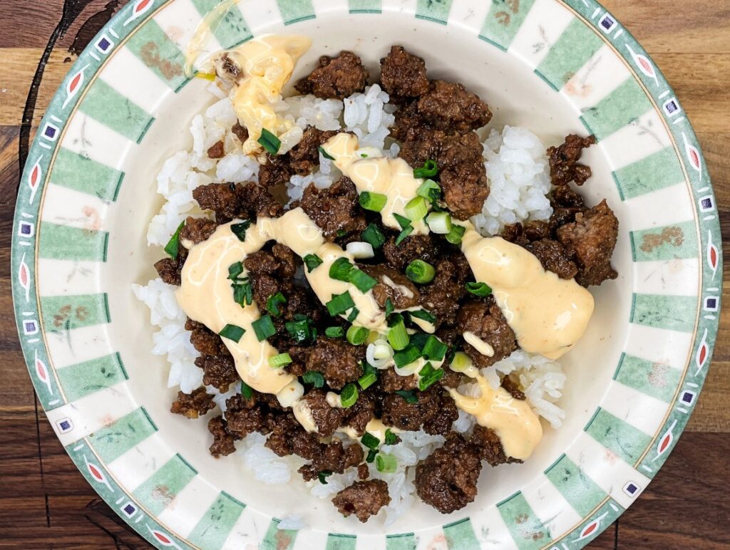 Korean ground beef bowls taste topped with green onion