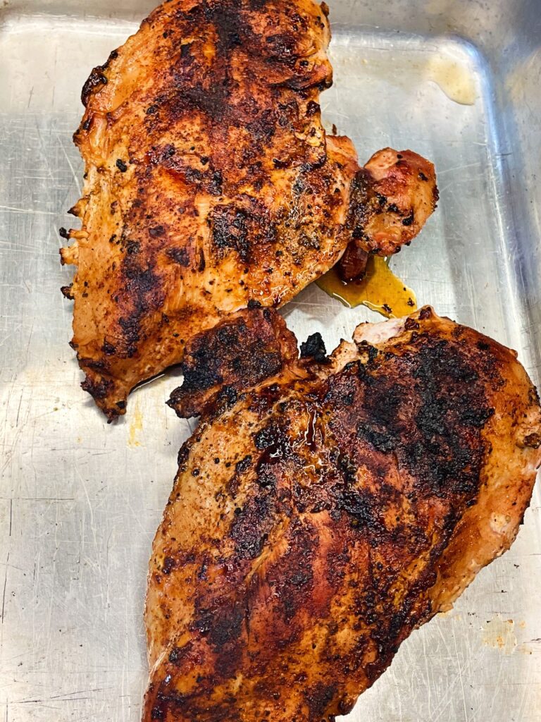 seasoned chicken on the grill