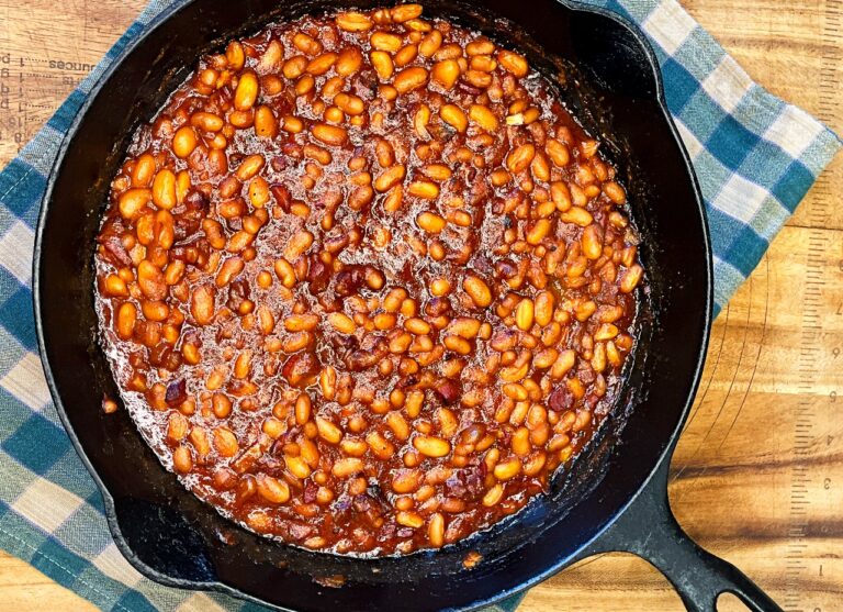 Homemade baked beans with bacon in a baking dish
