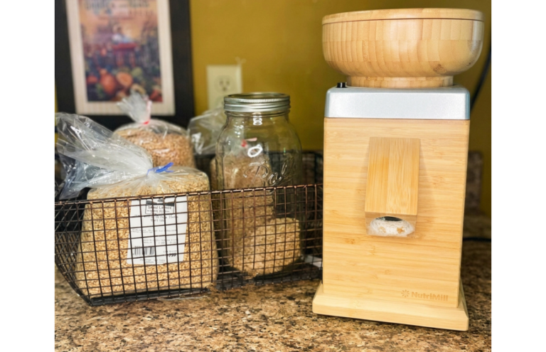 flour mill and wheat berries on a counter top