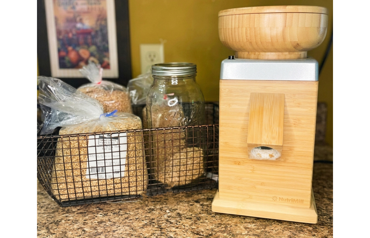 flour mill and wheat berries on a counter top