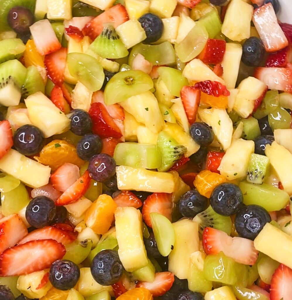 Strawberries, blueberries, kiwi, pineapple, and grapes tossed together for an easy fruit salad.