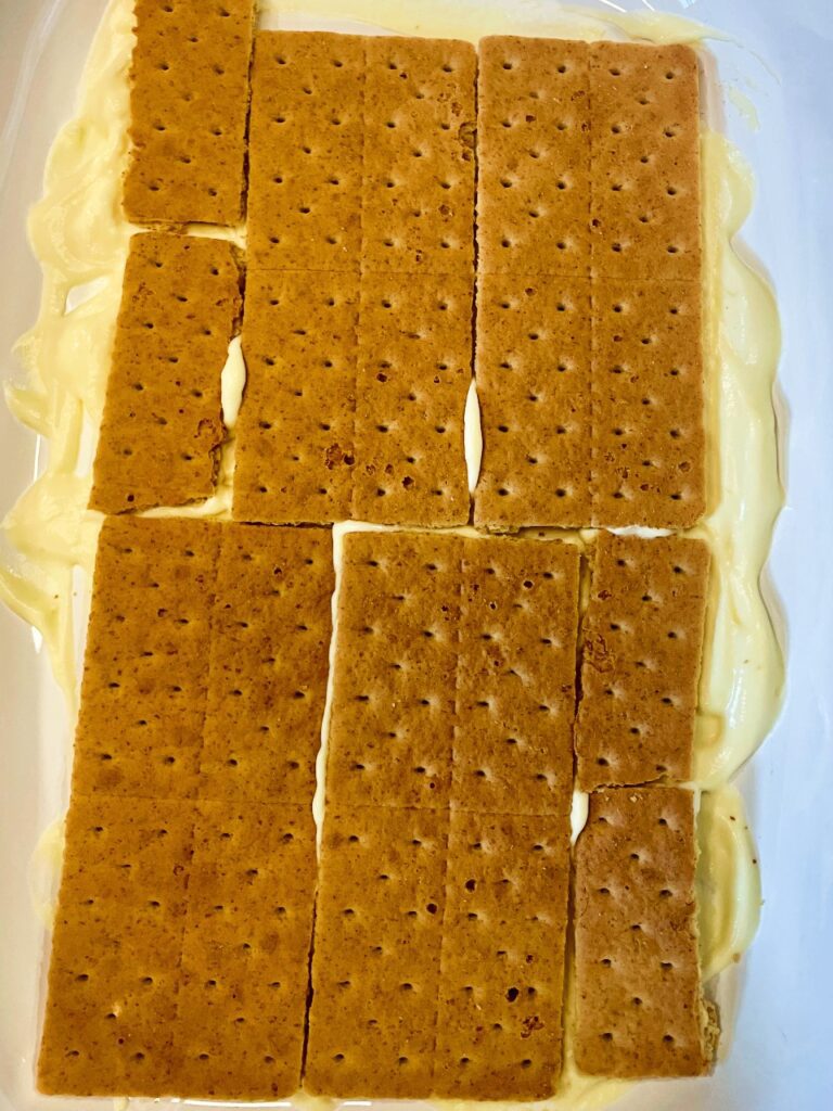 assembling the layers of the strawberry icebox cake