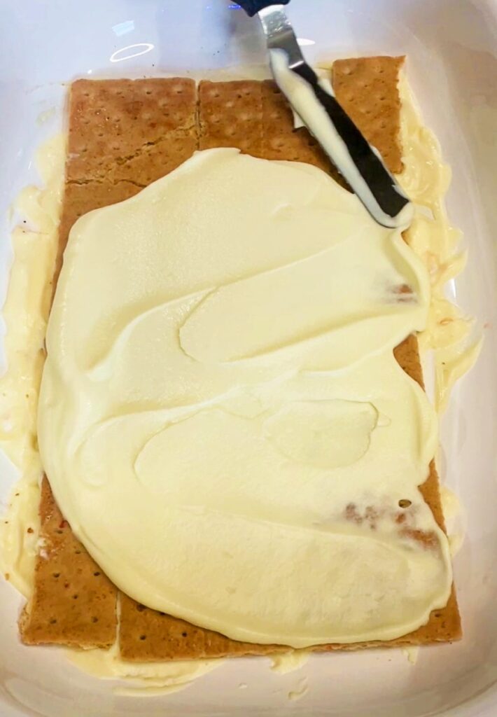 assembling the layers of the strawberry icebox cake