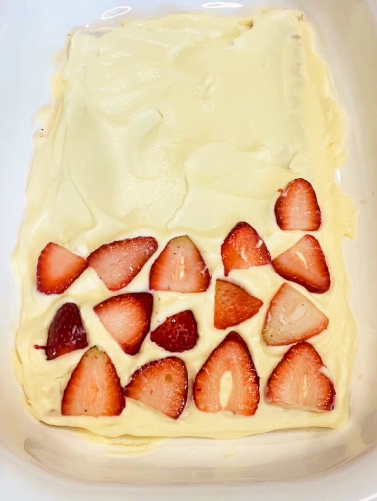 assembling the layers of the strawberry icebox cake
