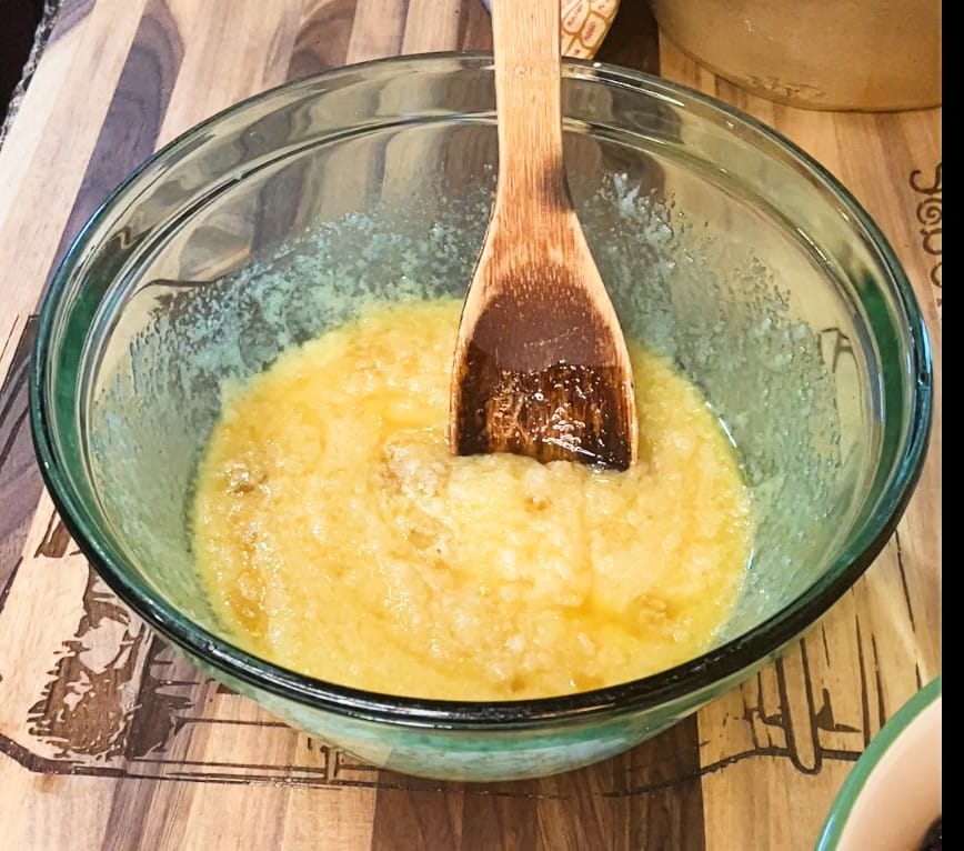 large mixing bowl, stir together the melted butter, granulated sugar, brown sugar, and vanilla extract.