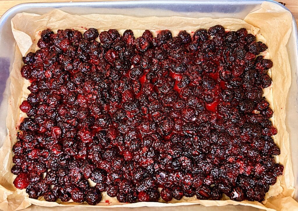 black raspberry filling spread evenly over the crust