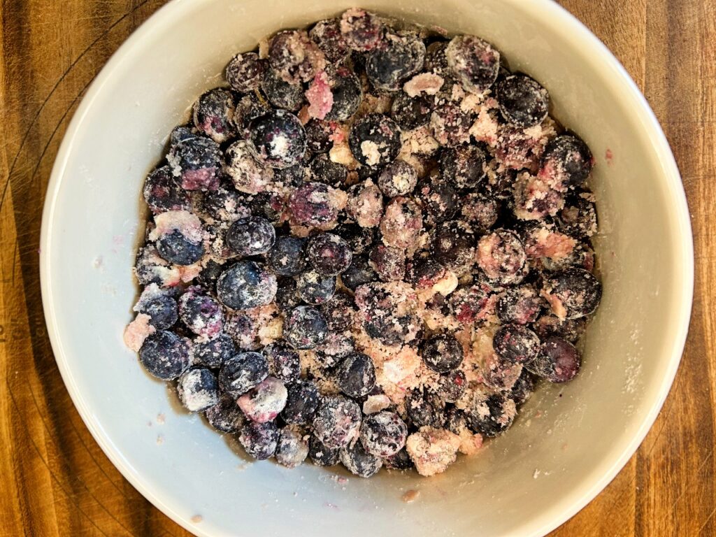 Blueberries mixed with sugar, lemon juice, vanilla, and thickener for crumble bar filling.