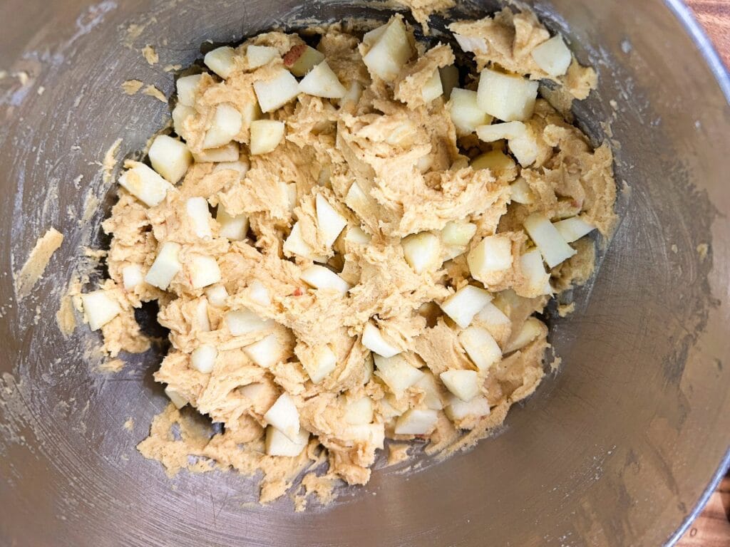Thick Apple Dapple Cake batter folded with fresh diced apples