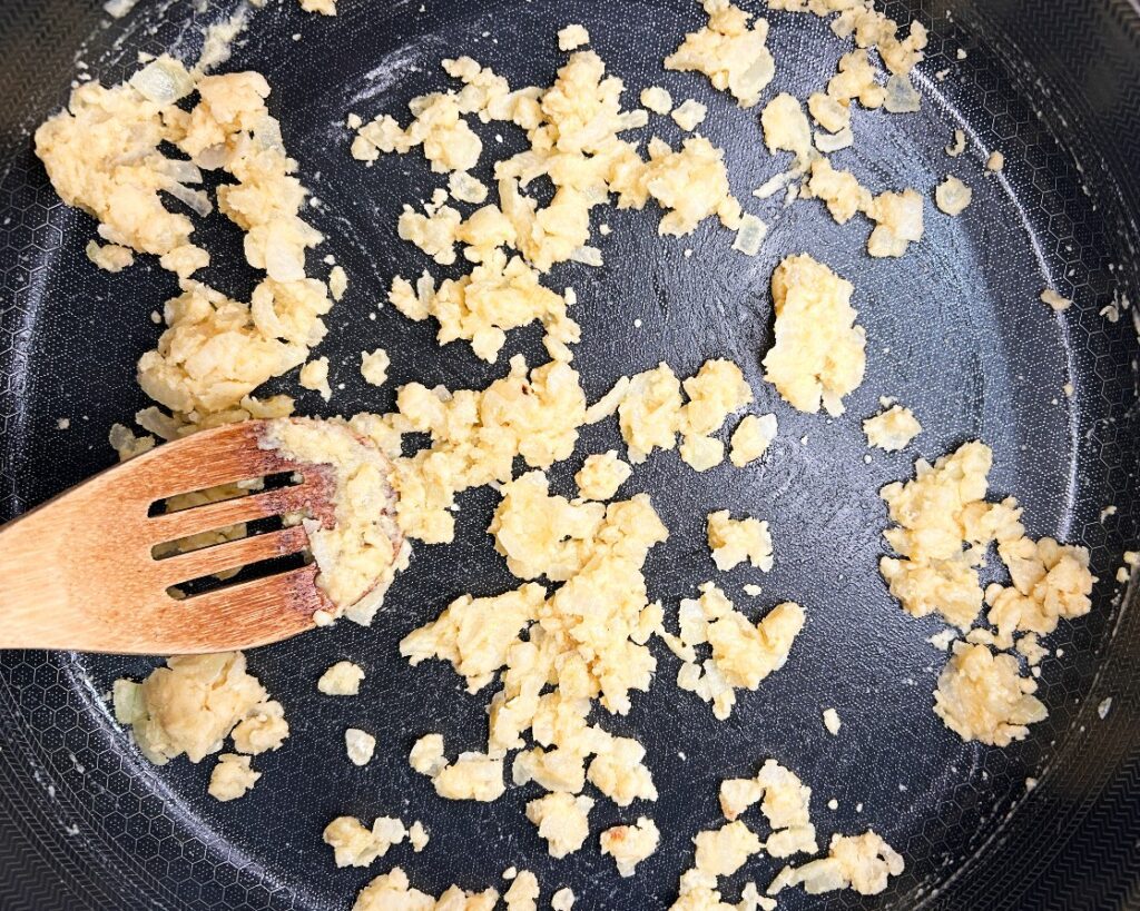 Flour mixed into onions and garlic to make a roux