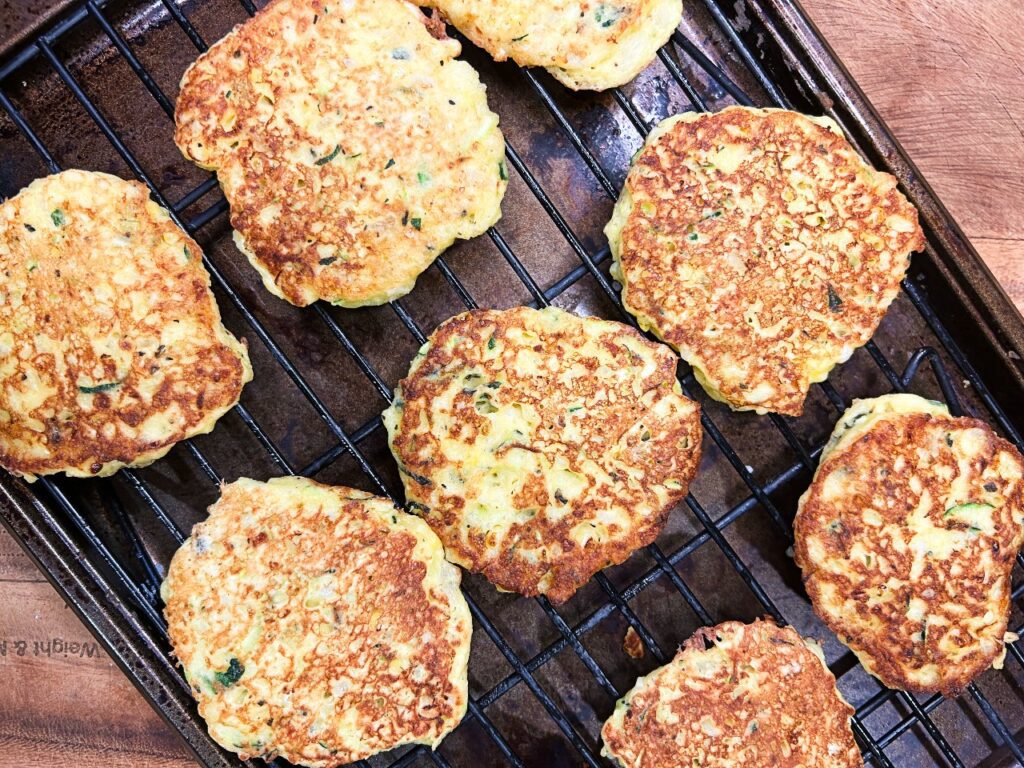 Old-Fashioned Zucchini Corn Fritters on a wire rack