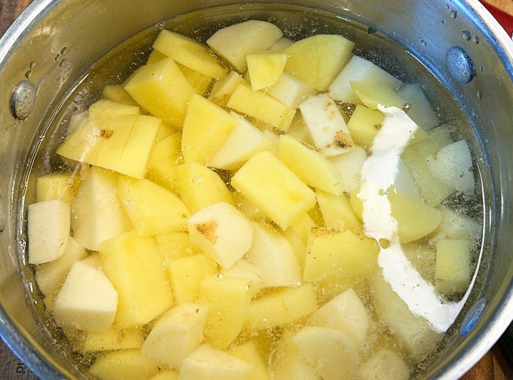White and Yukon Gold potatoes cut into chunks for homemade mashed potatoes