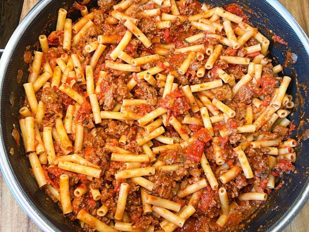 ziti combined with meat sauce 