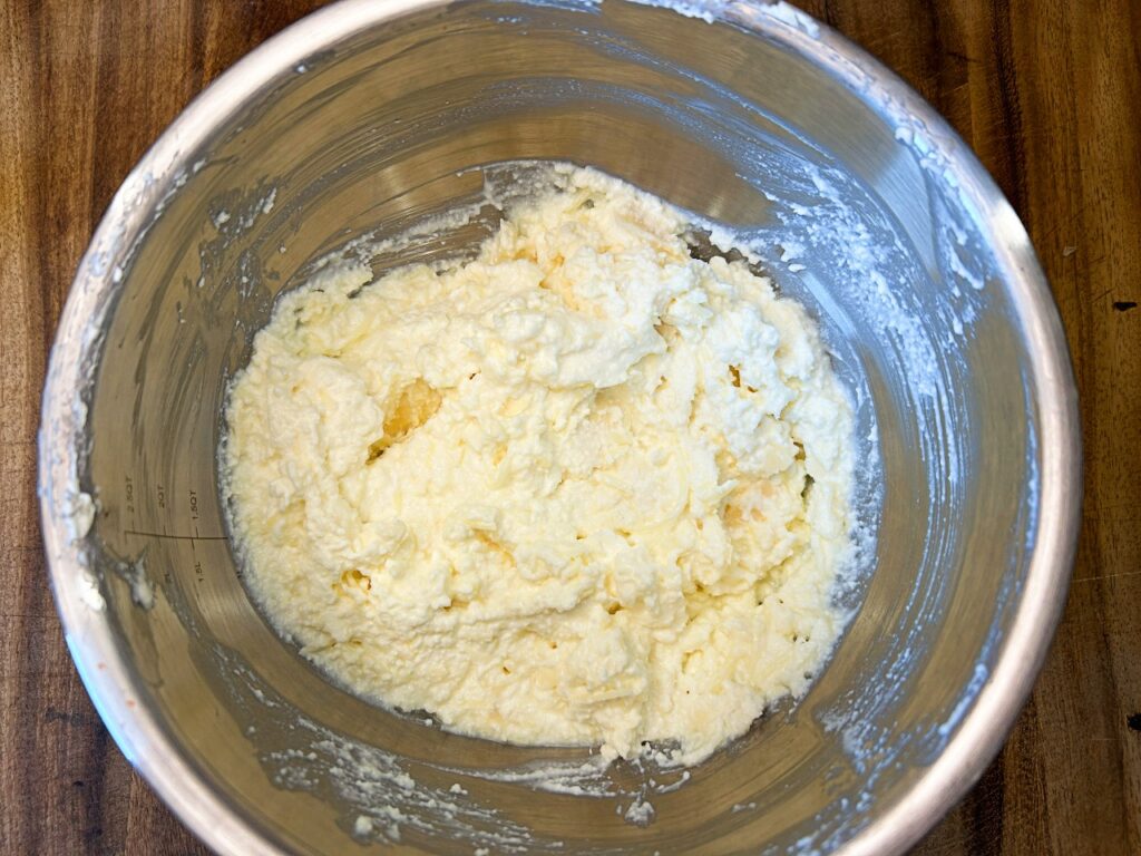 ricotta cheese, softened cream cheese, mozzarella, Parmesan, garlic powder, and dried herbs mixed together in a bowl