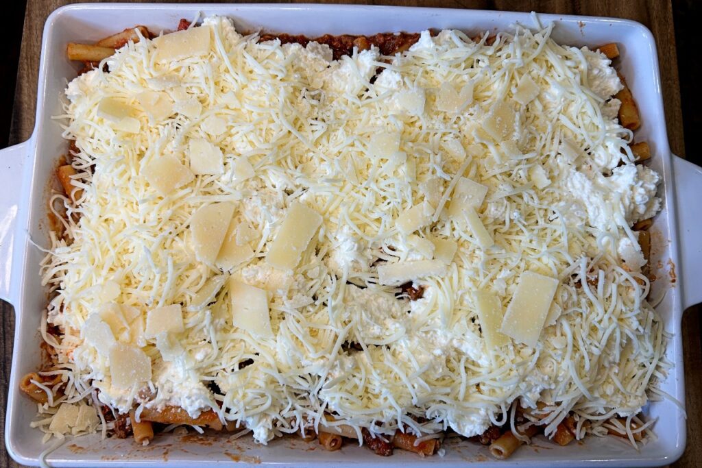 extra mozzarella and Parmesan cheese on top of cheese mixture  