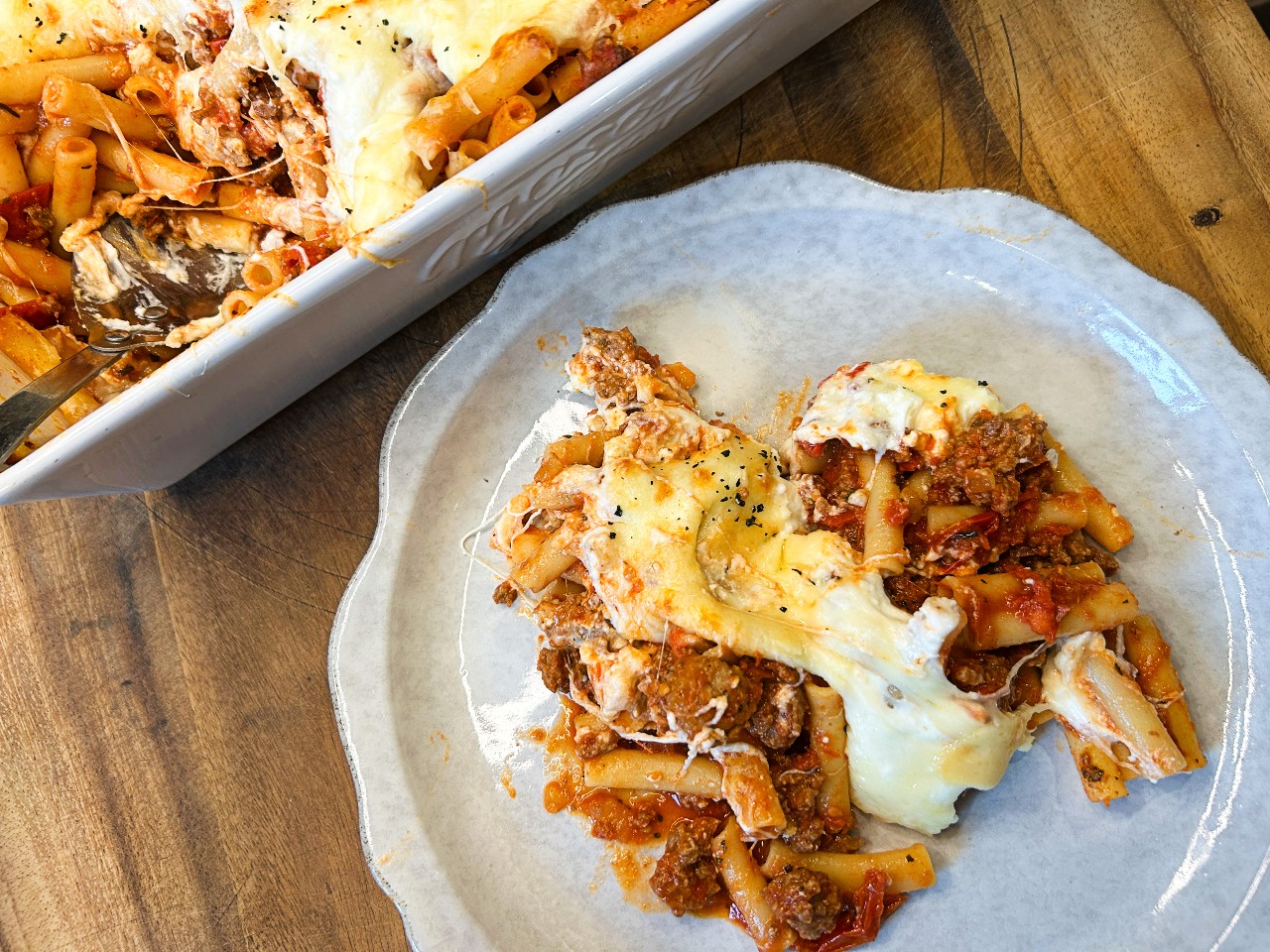 Easy baked ziti with ricotta and mozzarella cheese in a baking dish