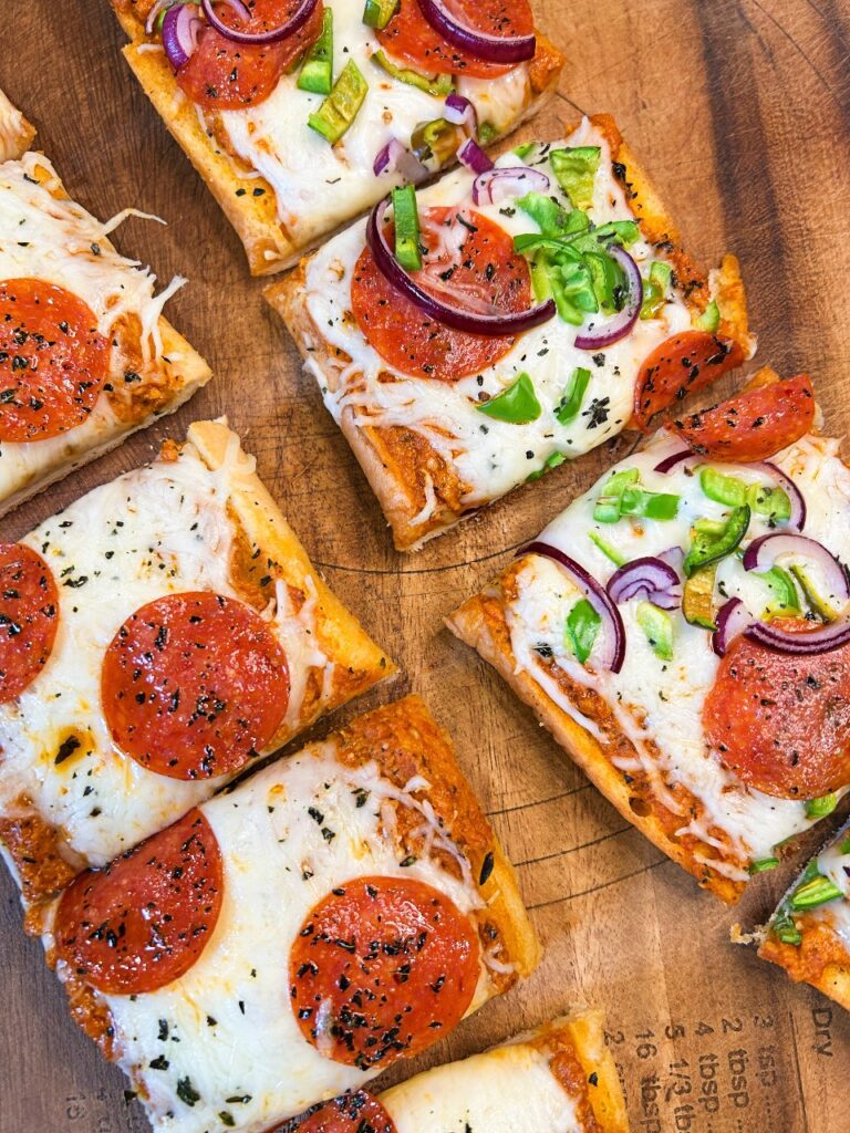 frozen garlic bread pizzas cut into serving size pieces