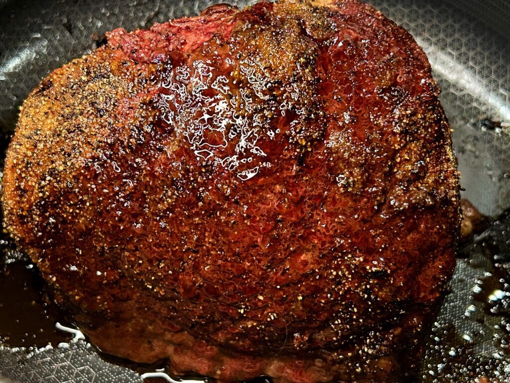 top round roast resting in Dutch oven