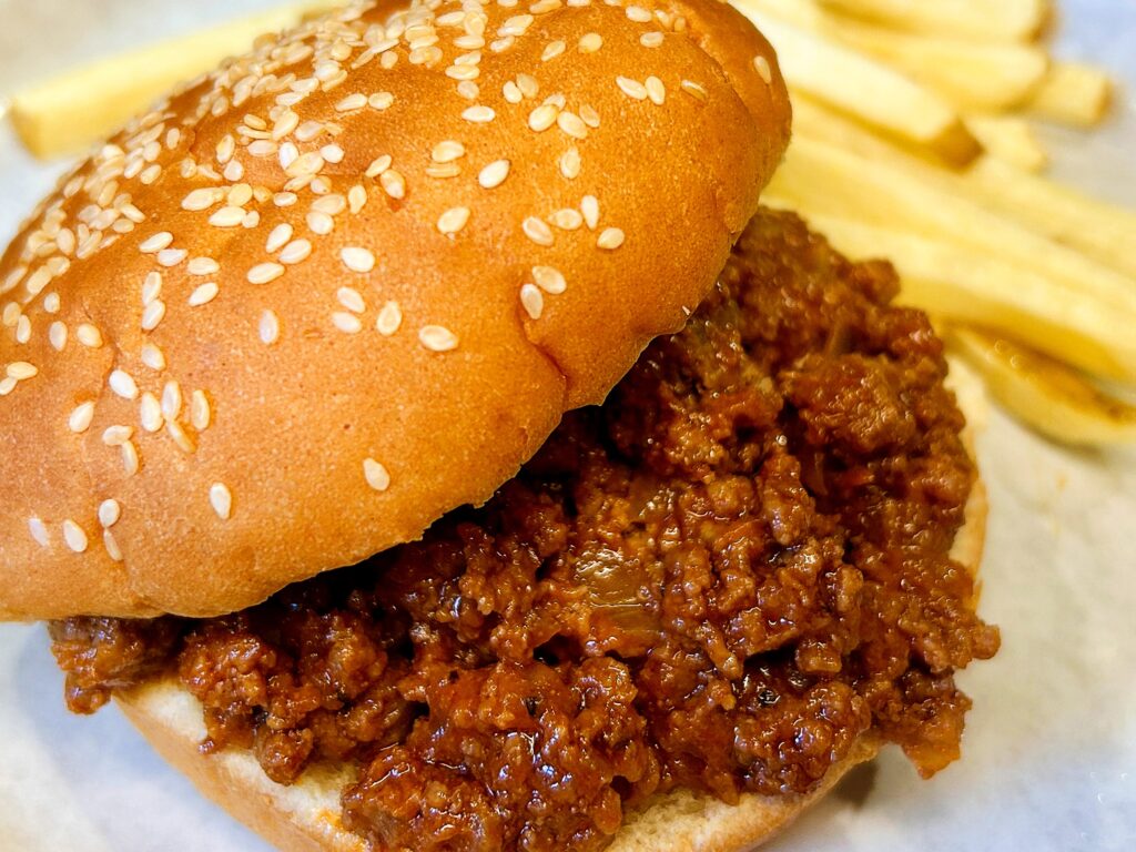 Easy homemade sloppy joes made from scratch with seasoned ground beef and a sweet and tangy homemade sloppy joe sauce served on hamburger buns.
