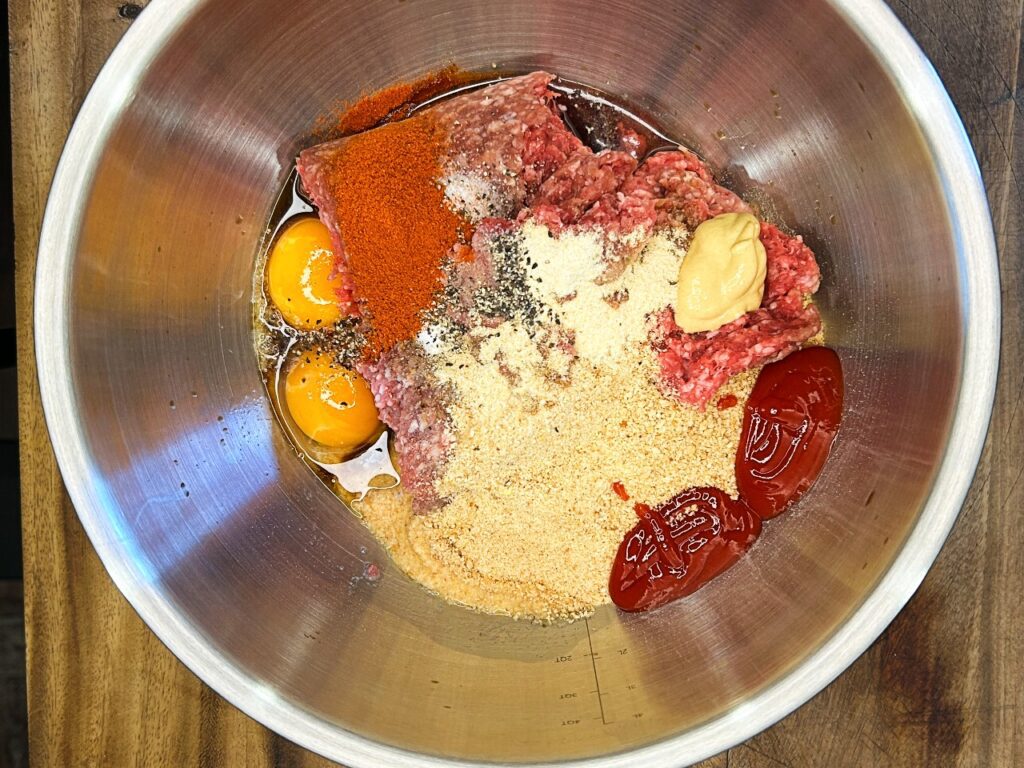 ground beef  with ingredients to make Salisbury steak
