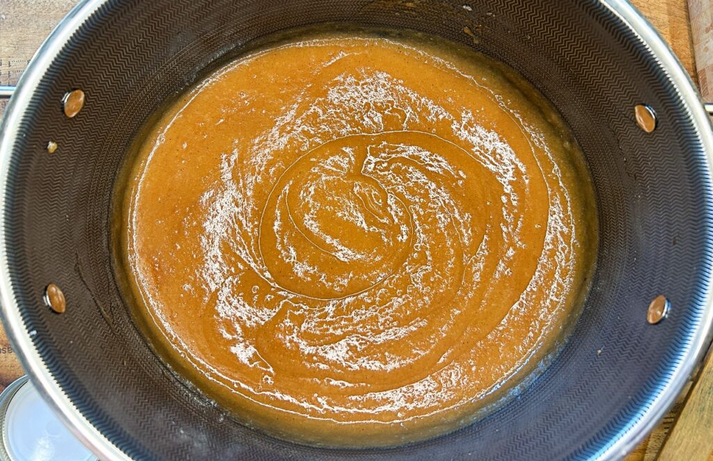 Blending softened apples into smooth apple butter